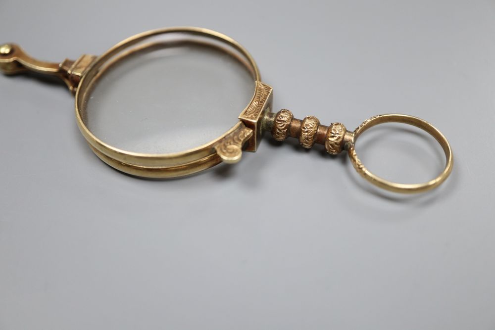 A pair of late Victorian engraved 12ct gold mounted lorgnettes, closed 8.7cm, gross 18.1 grams (TEST).